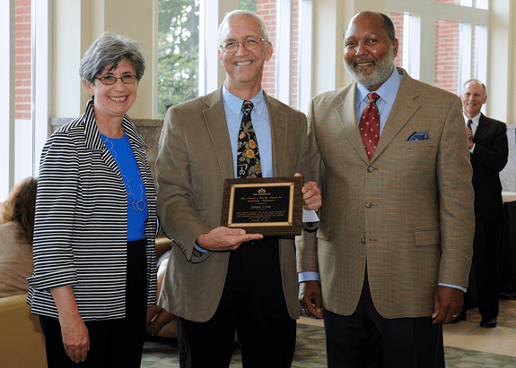 Provost Joan Lorden, Jim Cook, Faculty President Eddy Souffrant, (Chancellor Phil Dubois in background)